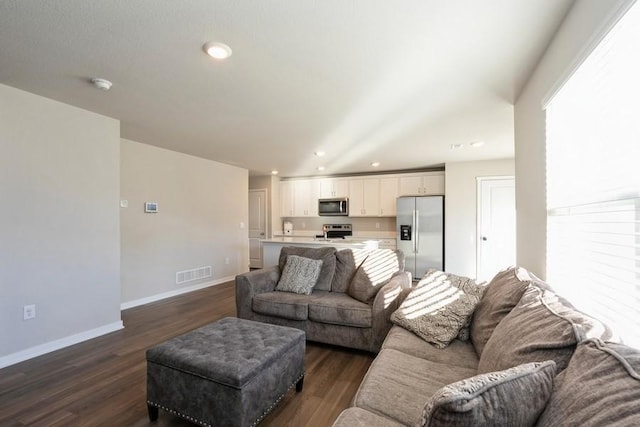 living room featuring dark hardwood / wood-style floors