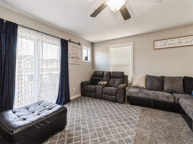 carpeted living room featuring ceiling fan