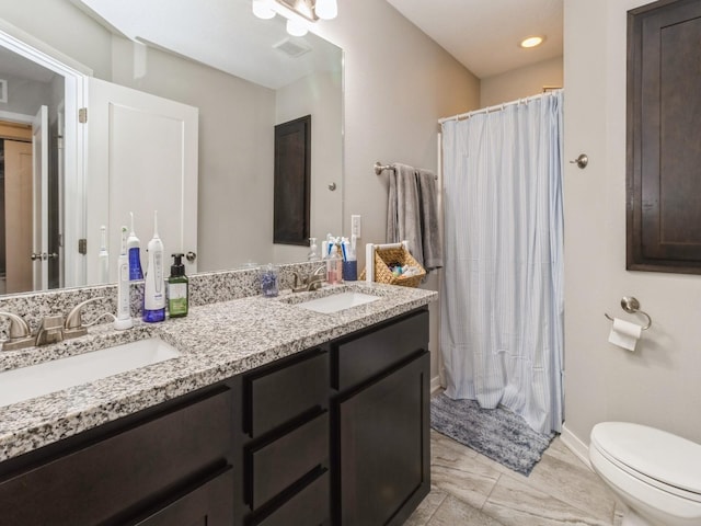 bathroom with vanity and toilet