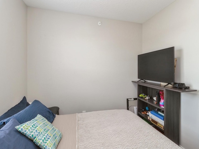 bedroom featuring a textured ceiling