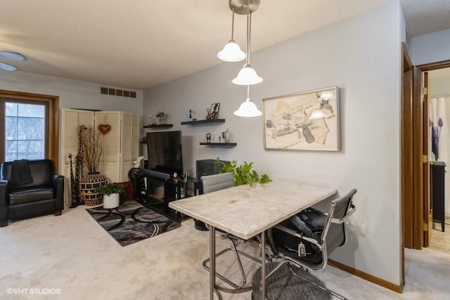 view of carpeted dining area