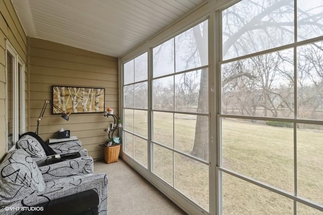 sunroom featuring vaulted ceiling