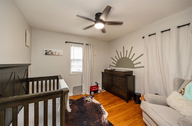 bedroom featuring ceiling fan and light wood-type flooring