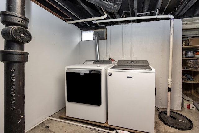 washroom featuring washing machine and dryer