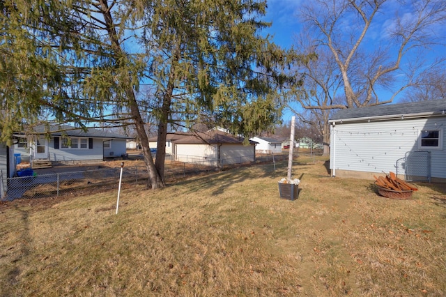 view of yard with a fire pit