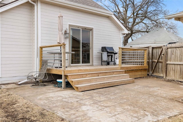 deck with area for grilling and a patio area