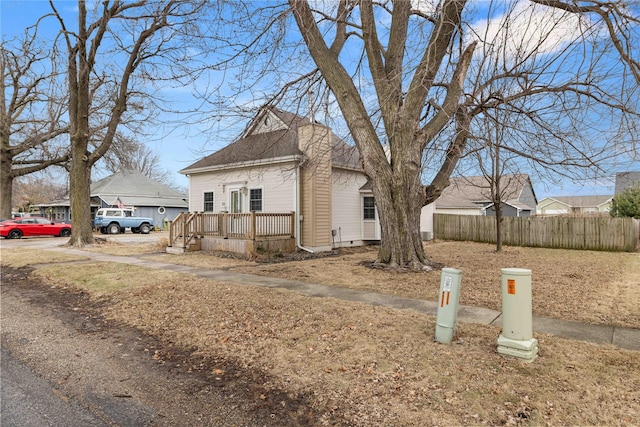 view of property exterior with a deck