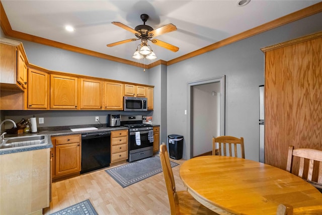 kitchen featuring sink, crown molding, ceiling fan, appliances with stainless steel finishes, and light wood-type flooring