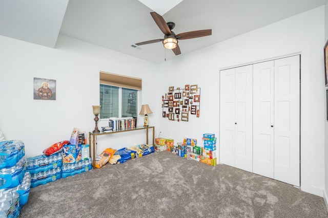 rec room with ceiling fan and carpet flooring