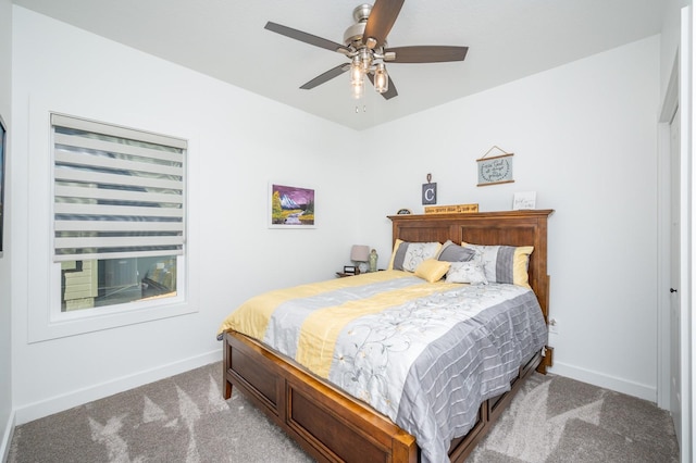 bedroom featuring ceiling fan and light carpet