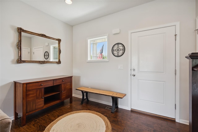 entrance foyer with dark hardwood / wood-style floors