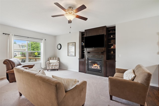 living room featuring carpet floors and ceiling fan