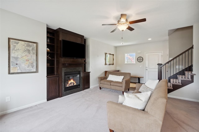 living room featuring ceiling fan and light carpet