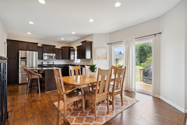 dining area featuring dark hardwood / wood-style floors