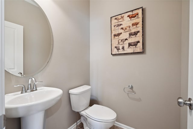 bathroom featuring sink and toilet