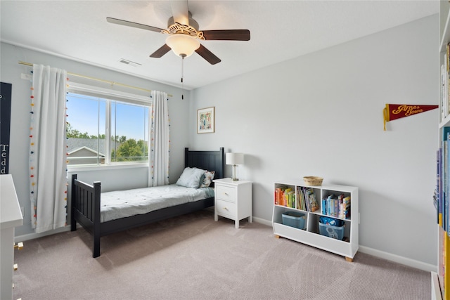 bedroom with ceiling fan and light carpet