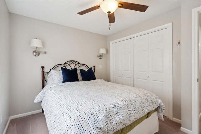 bedroom featuring ceiling fan, a closet, and carpet