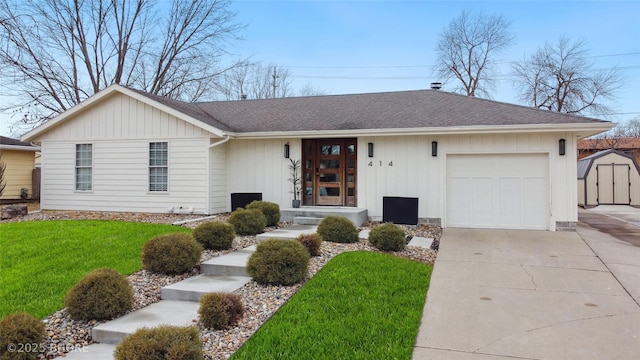 single story home featuring a garage and a front lawn