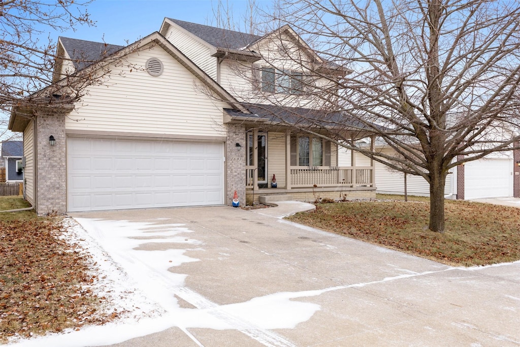 front of property featuring a garage and covered porch