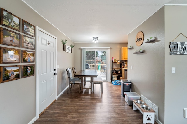 dining area featuring dark hardwood / wood-style flooring