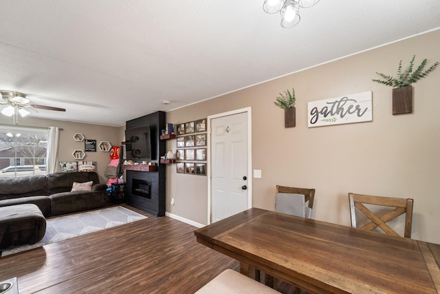 interior space with ceiling fan and wood-type flooring