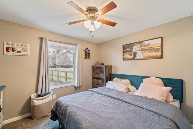 bedroom with ceiling fan and carpet flooring