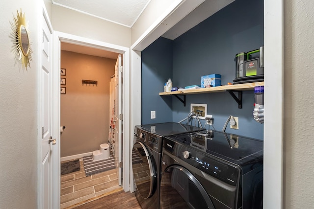 washroom featuring washer and clothes dryer