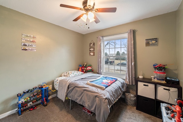 bedroom featuring ceiling fan and carpet