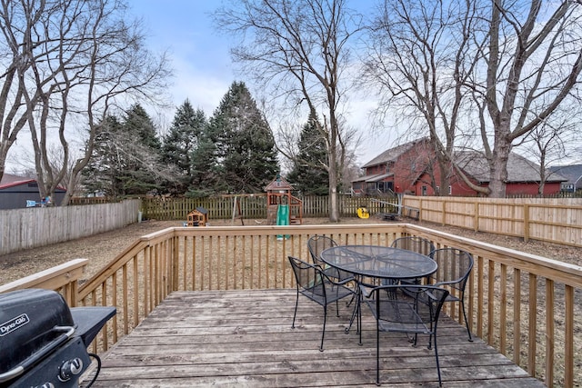 deck with grilling area and a playground