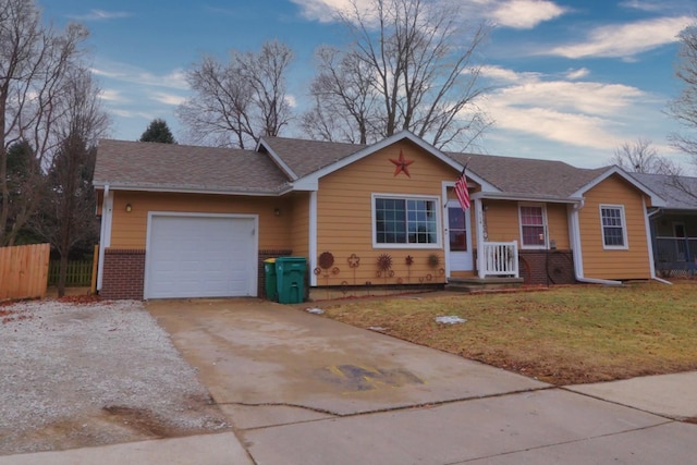 ranch-style house featuring a garage and a front yard