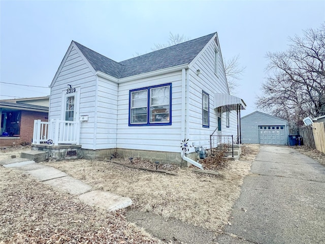 view of front of house featuring an outbuilding and a garage