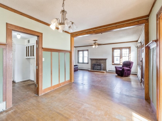 unfurnished living room with crown molding, a brick fireplace, a baseboard heating unit, and hardwood / wood-style floors