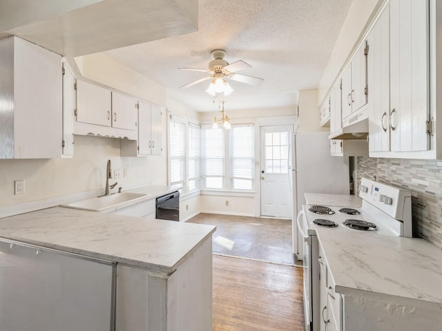 kitchen with sink, dishwasher, white cabinets, and white electric range oven