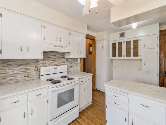 kitchen featuring tasteful backsplash, white electric range, white cabinets, and light hardwood / wood-style flooring