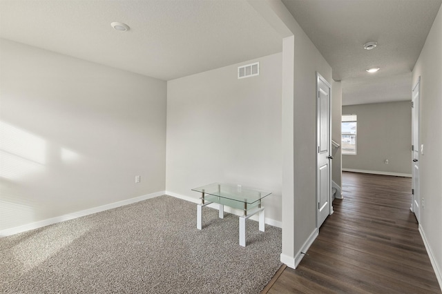 hallway featuring dark hardwood / wood-style floors