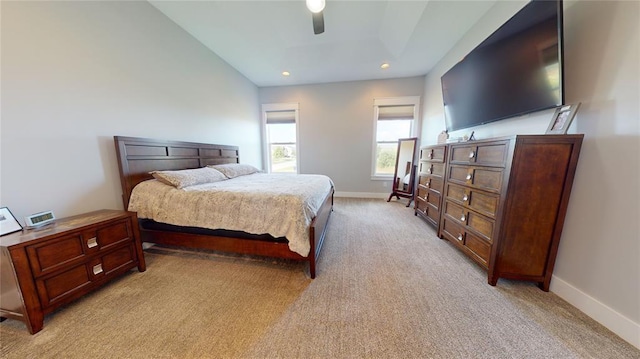 bedroom featuring ceiling fan and light colored carpet