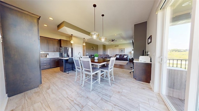 dining room featuring ceiling fan