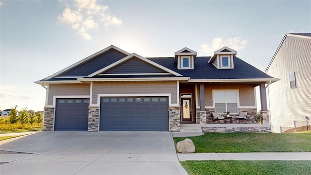 craftsman-style house featuring a garage and a front yard