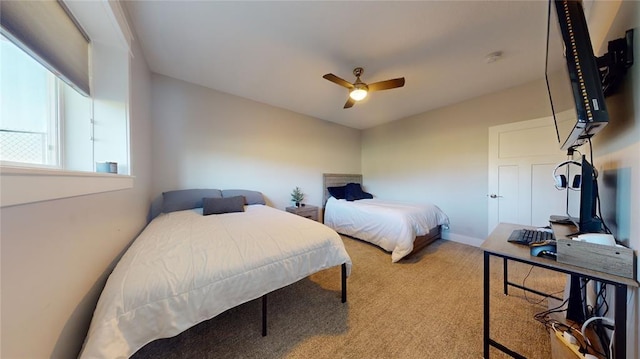 bedroom featuring ceiling fan and carpet flooring