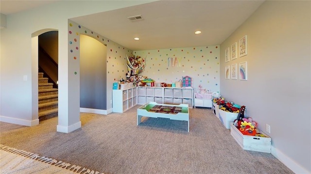 playroom featuring light carpet