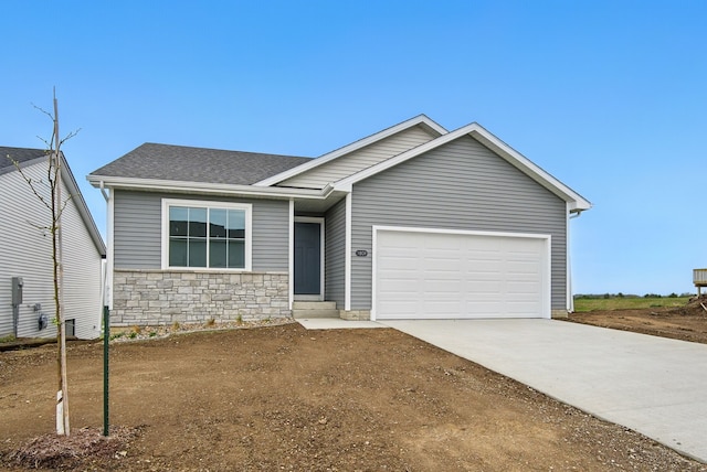 1809 20th Ave SE, Altoona, IA 50009 - ranch-style house with driveway, a shingled roof, stone siding, and a garage