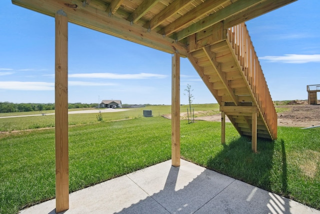 1809 20th Ave SE, Altoona, IA 50009 - view of patio / terrace featuring stairs and a rural view