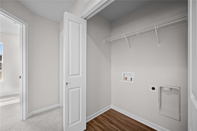 clothes washing area with hookup for a washing machine, hardwood / wood-style floors, and electric dryer hookup