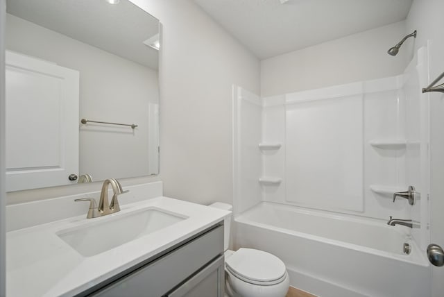 full bath featuring vanity, toilet, and tub / shower combination