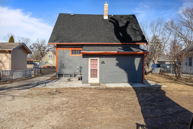 back of house with a patio