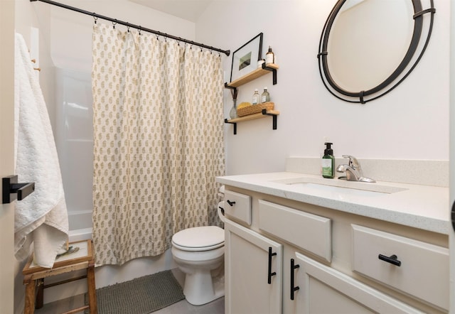 full bathroom with vanity, shower / bath combo, and toilet