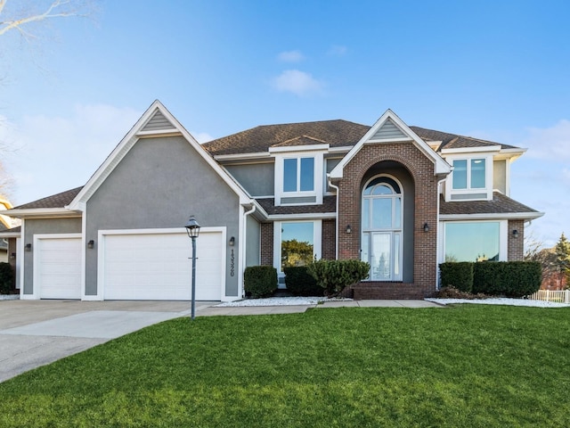 view of front property with a garage and a front lawn