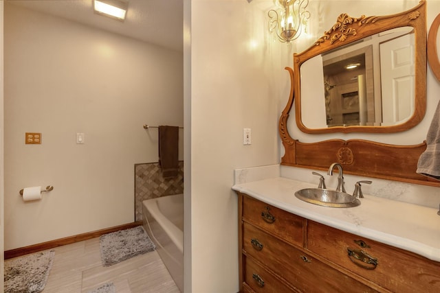 bathroom featuring vanity and a tub