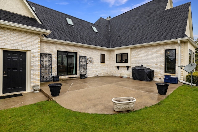 exterior space featuring a yard and a patio area