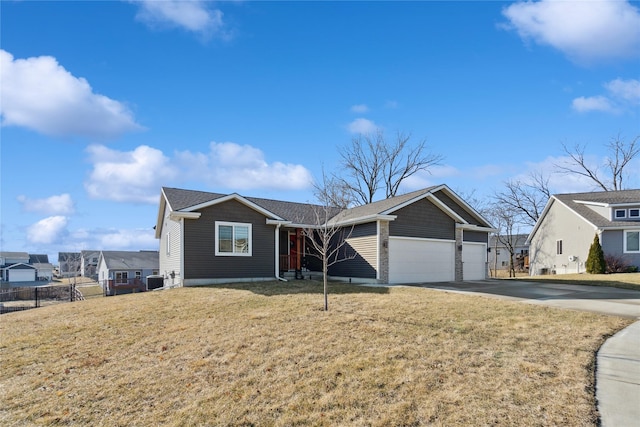 view of front of property with a garage and a front lawn